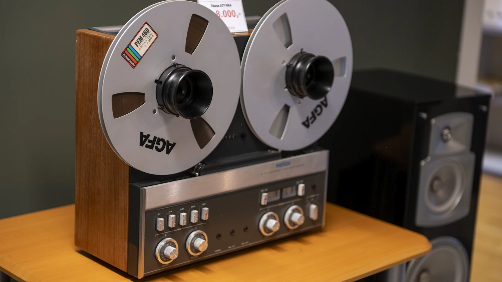 A Revox reel-to-reel deck with two AGFA tape reels mounted on it, a machine that records while something is happening rather than reconstructing it afterwards